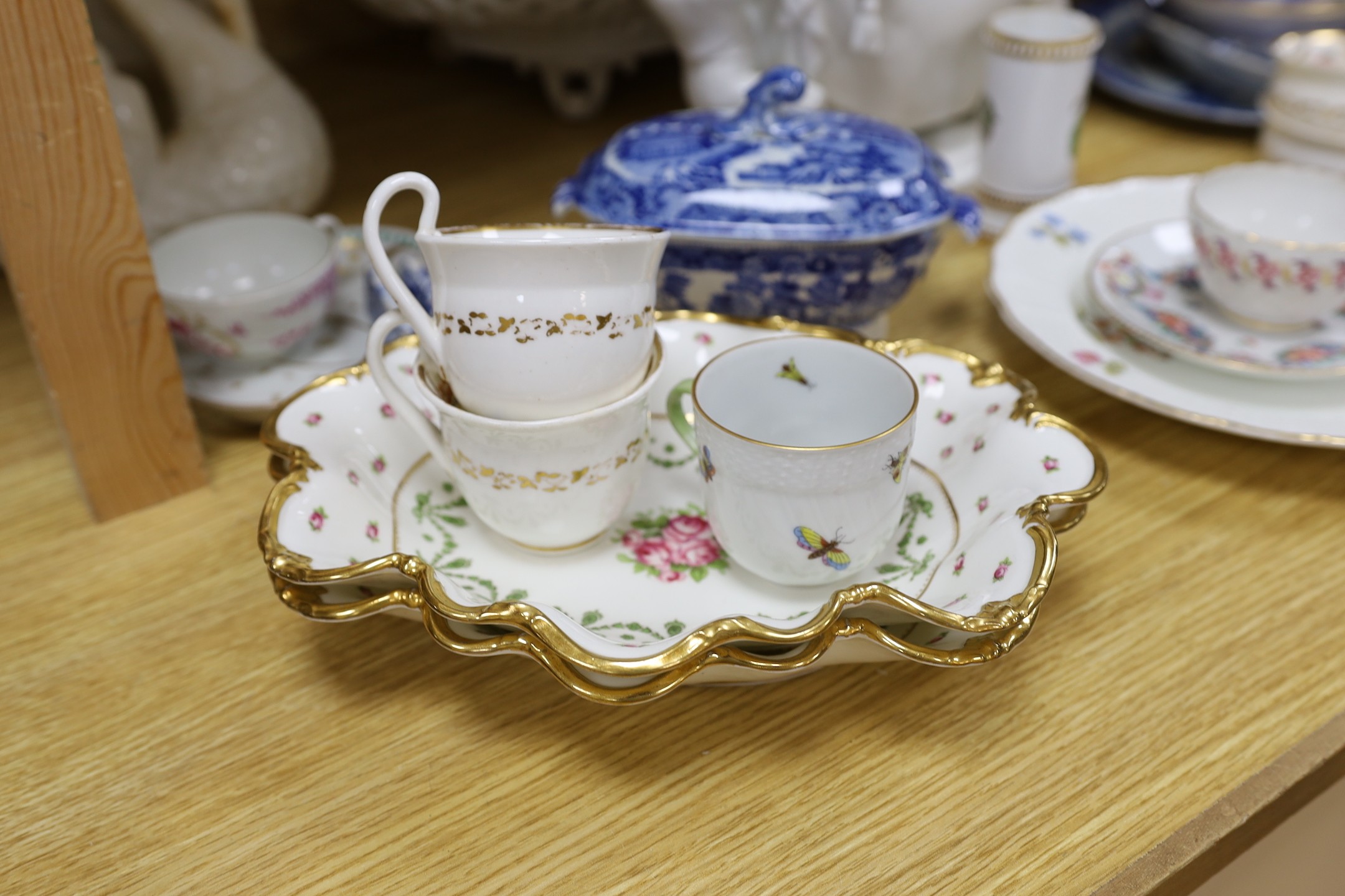 A group of Staffordshire blue and white pottery, including a sauce tureen and cover, together with a selection of decorative tea and dessert wares and ceramic centrepieces, one modelled as a cockerel
